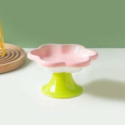 Colorful ceramic jewelry or soap dish with pink and green design, perfect for home decor or bathroom organization.
