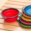 Red collapsible silicone bowl for outdoor use and camping, versatile and lightweight, colorful collapsible dishware for travel and picnics, eco-friendly kitchen accessory.