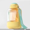 Bright yellow and transparent plastic water bottle with a teal strap labeled "HIP PET," designed for children, featuring a playful and colorful aesthetic perfect for kids' accessories and hydration needs.
