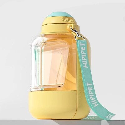 Bright yellow and transparent plastic water bottle with a teal strap labeled "HIP PET," designed for children, featuring a playful and colorful aesthetic perfect for kids' accessories and hydration needs.