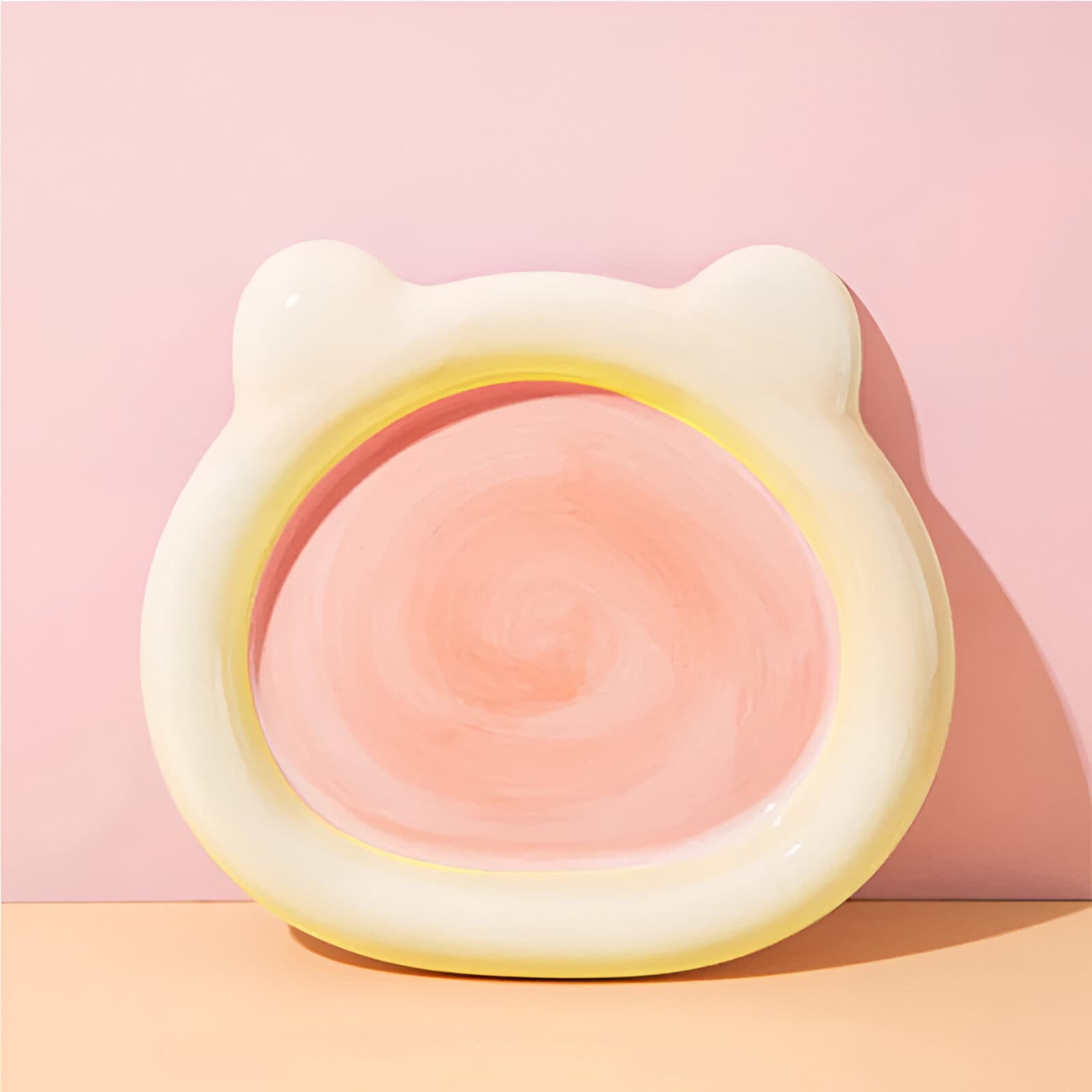 Soft pink and white bear-shaped night light with warm glow, perfect for children's bedrooms and adding cozy ambiance to any space.