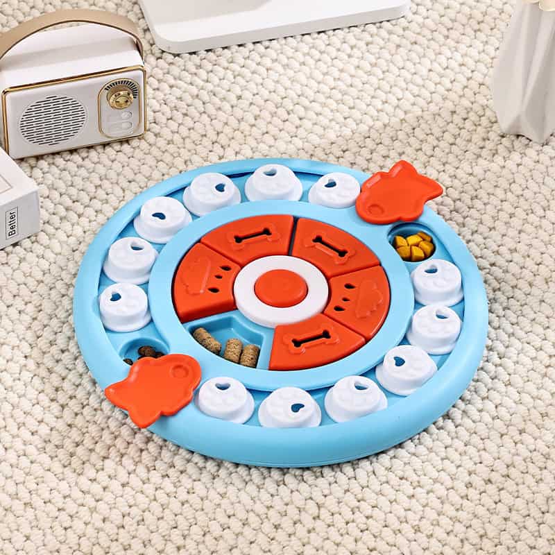 Colorful toddler game with rotating discs and animal-shaped pieces, designed for early learning and entertainment, displayed on a soft textured carpet at Monalisa Store.
