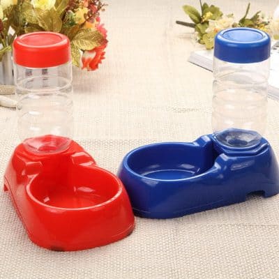 Red and blue dual pet feeding bowls with water dispensers, ideal for cats and small dogs, designed for easy feeding and hydration at Monalisa Store.