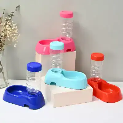 Plastic water dispenser bottles with colorful bases in pink, blue, orange, and white, ideal for home or office hydration needs. Featuring stackable design for easy use and storage.