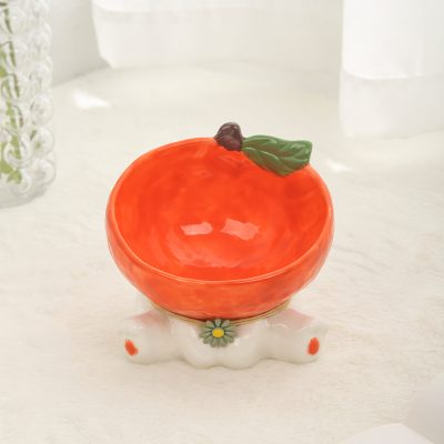Peach-shaped porcelain bowl, decorative ceramics, blush orange fruit dish, ceramic fruit bowl with green leaf accent, stylish home decor item for kitchen or living room, Monalisa Store.