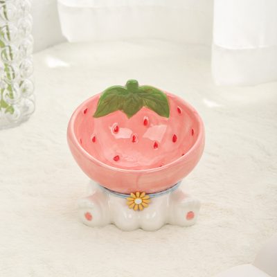 Strawberry-themed decorative ceramic bowl with a green leaf detail, ideal for home decor or kitchen storage.