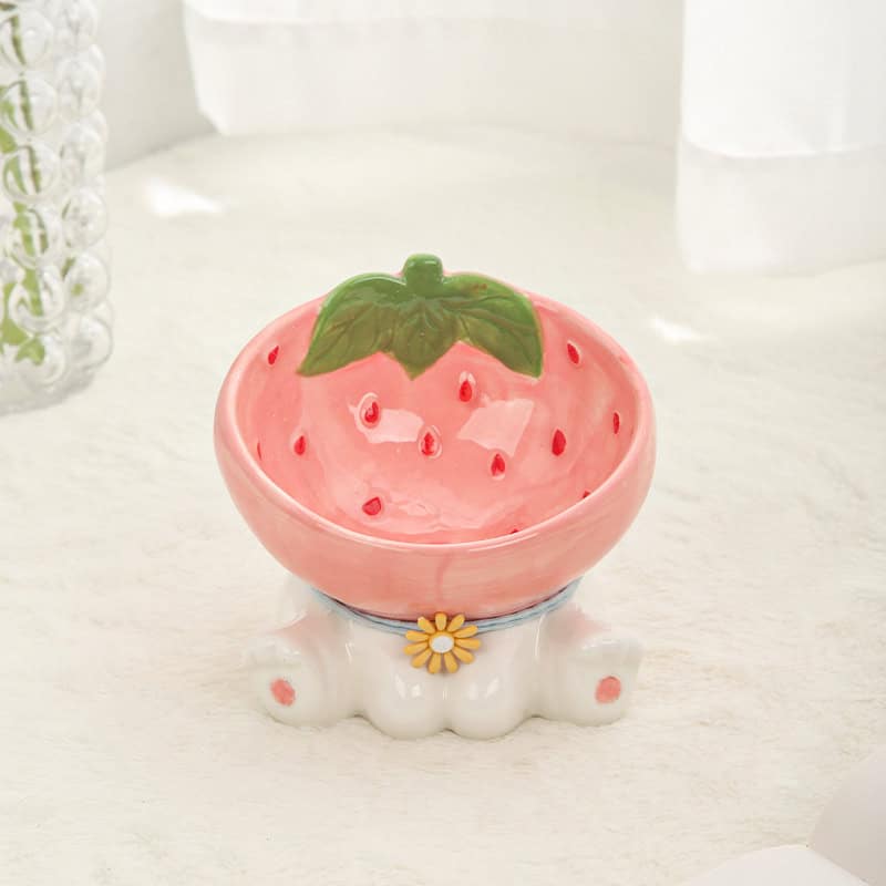 Strawberry-themed decorative ceramic bowl with a green leaf detail, ideal for home decor or kitchen storage.