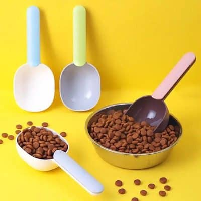 Lego ice cream scoops with brown beans in a bowl over a yellow background.