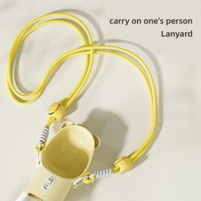 Yellow carry-on person's lanyard with bear-shaped holder for ID or keys, ideal for travel and daily use. Perfect for keeping essentials organized and easily accessible. Stylish and functional accessory.