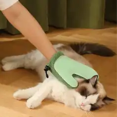 Soft pet grooming glove for cats and dogs, gentle massage and shedding tool, pet hair removal, home pet care product, suitable for allergies and grooming routine needs.