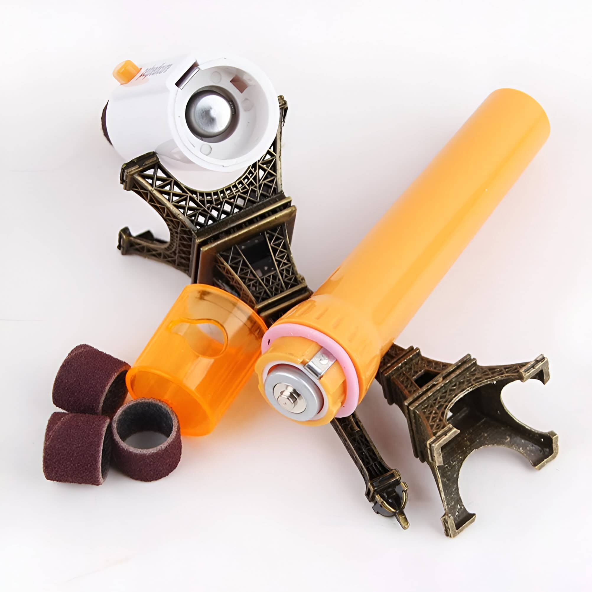 Precision dental tools and whitening gel with a miniature Eiffel Tower decor, emphasizing advanced dental care products and aesthetic teeth whitening solutions for a brighter smile.