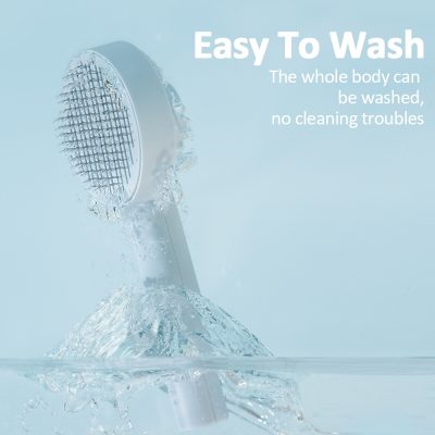 Waterproof electric facial cleansing brush on a light blue background, showcasing its easy to wash feature for skincare enthusiasts.