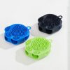 Colorful silicone dish scrubbers in blue, black, and green for a durable and effective cleaning experience. Perfect for kitchen, dishware, and utensil cleaning.