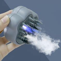 Blue light teeth whitening device emitting vapor for dental aesthetic treatment in a Monalisa Store clinic, professional dental equipment for smile enhancement and oral health care.