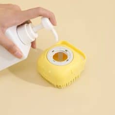 Disinfectant spray being used on a yellow baby bottle sterilizer with a cleaning brush for optimal hygiene.