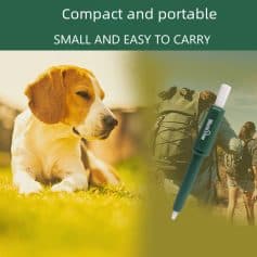 Dog lying on grass with a portable medical device for pets and humans, suitable for travel and outdoor use.