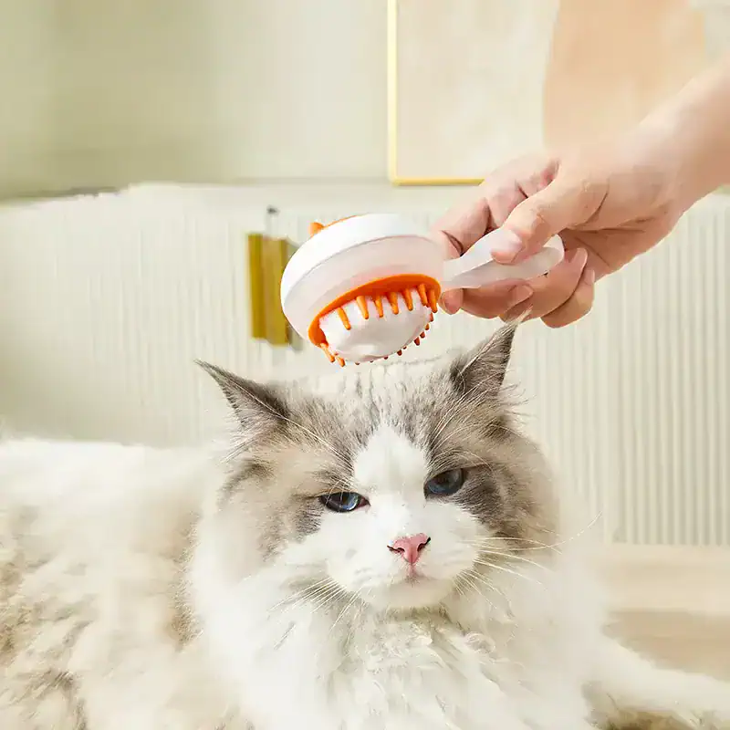 Gentle pet grooming brush for cats, removing loose fur and dirt to keep your feline healthy and clean. Designed for comfortable use on long and short-haired cats.