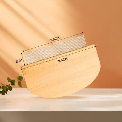 Precision eyelash extension comb with metallic teeth, measuring 7.6cm by 2cm, designed for professional salon use to ensure perfect lash separation and grooming.