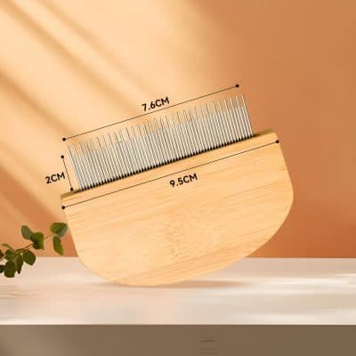 Precision eyelash extension comb with stainless steel bristles on a wooden handle, ideal for eyelash grooming and separation, measuring 7.6 cm by 2 cm, perfect for eyelash and lash extension care.