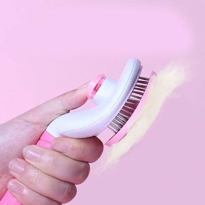 Clean and modern pink and white facial brush with soft bristles, ideal for skincare routines at Monalisa Store.