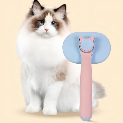 Claw grooming brush for cats with pink and blue design, ideal for pet hygiene and grooming.