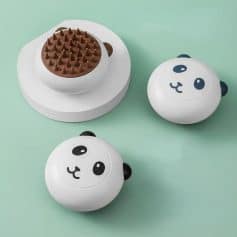 Panda-shaped chocolate fondue pots set on pastel background.