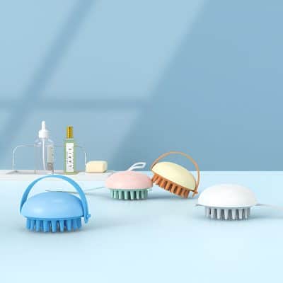 Colorful handheld silicone facial cleansing brushes for skincare routines, displayed on a pastel background. Perfect for exfoliating and facial cleansing, ideal for use at home or in beauty salons.