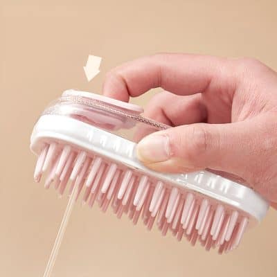 Flexible eyelash comb with transparent handle and pink bristles for eyelash extension maintenance and styling. Perfect for professional use.