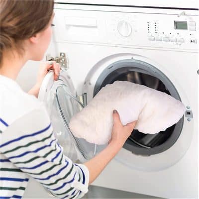 Tumble dryer cleaning process at Monalisa Store, professional laundry care for optical products, laundry services for eyewear and optical equipment in a modern facility.