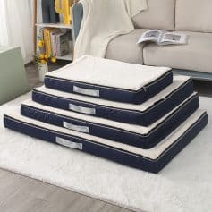 Plush pet bed stack with navy blue exterior and soft white interior, ideal for dogs or cats, in a cozy living room setting for comfort and relaxation.