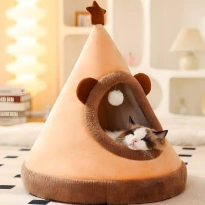 Plush cat house shaped like a tipi with cozy interior and playful design, perfect for pet comfort and decor enhancement in modern homes.