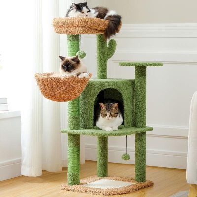 Fluffy cats relaxing on green and orange cat tree with multiple platforms and cozy hideouts, perfect for indoor feline enrichment and play.