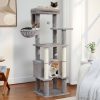 Plush cat tree with multiple perches and scratching posts featuring three cats lounging on the structure in a modern living room.