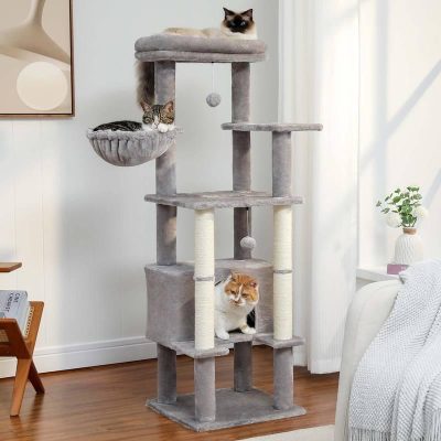 Plush cat tree with multiple perches and scratching posts featuring three cats lounging on the structure in a modern living room.