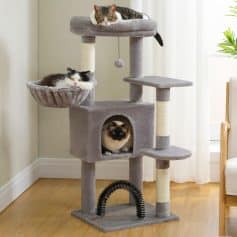 Luxury cat tree with multiple levels and cozy hiding spots for cats, perfect for home pet entertainment and exercise.
