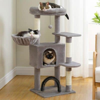 Luxury cat tree with multiple levels and cozy hiding spots for cats, perfect for home pet entertainment and exercise.