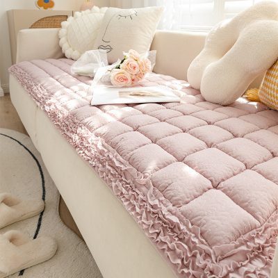Pink velvet sofa bed with ruffled edges and decorative pillows, cozy reading nook with sunlight, perfect for home decor and relaxation, Monalisa Store interior.
