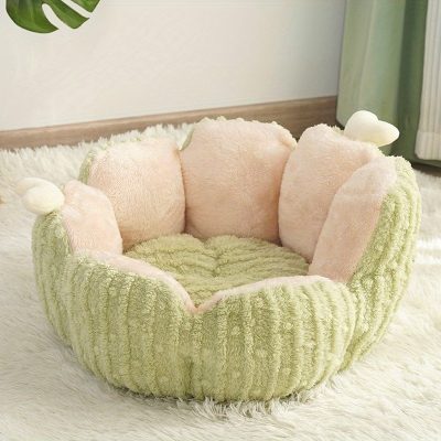 Soft plush pet bed with a cozy round design, pastel pink and green colors, and small bear ear accents for a comfortable and stylish resting space for pets.