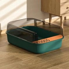Sleek modern pet litter box with privacy shield, made of durable plastic and stylish design perfect for indoor cats. Designed for easy cleaning and comfortable use.