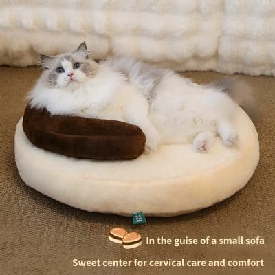 Relaxing cat on plush pet sofa, ideal for cozy cervical care and comfort. Perfect for pet relaxation and health support, combining softness with ergonomic design. Suitable for small to medium cats.