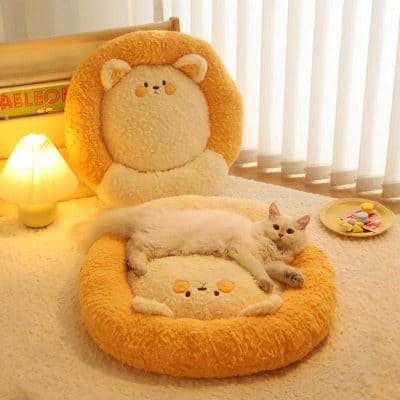 Fluffy plush bear-shaped chair with cat resting on it, cozy bedroom with soft lighting, decorative pillows, and candy dish, perfect for comfort and relaxation in a modern home.
