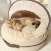Luxurious cat bed with soft plush interior and stylish canopy, perfect for feline comfort and relaxation. Ideal for pet owners seeking quality cat furniture and cozy spaces for their cats.