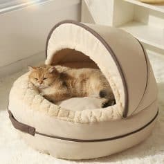 Luxurious cat bed with cozy enclosure and plush interior, perfect for feline relaxation and comfort at home. Ideal for pet owners seeking stylish, comfortable cat furniture.