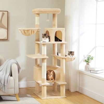 Luxurious beige multi-level cat tree with cozy cubbies, scratching posts, and lounging platforms for cats, placed in a bright, modern living room. Perfect for indoor feline fun and enrichment.