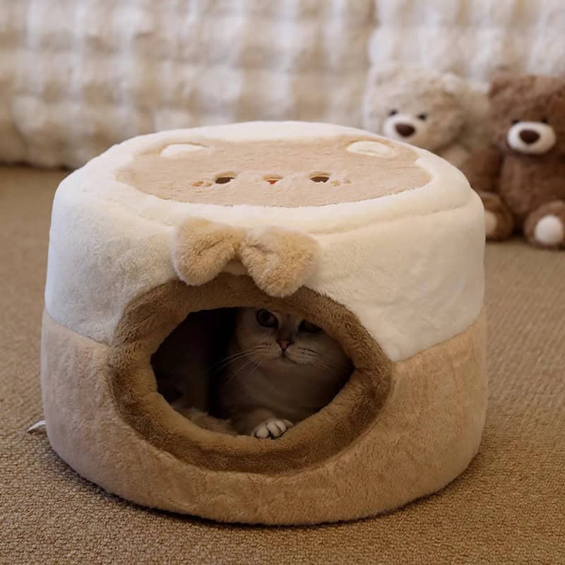 Cute cat hiding in a plush, cozy bear-themed pet bed, ideal for comfort and warmth. Perfect for pet lovers seeking stylish, functional pet furniture from Monalisa Store.