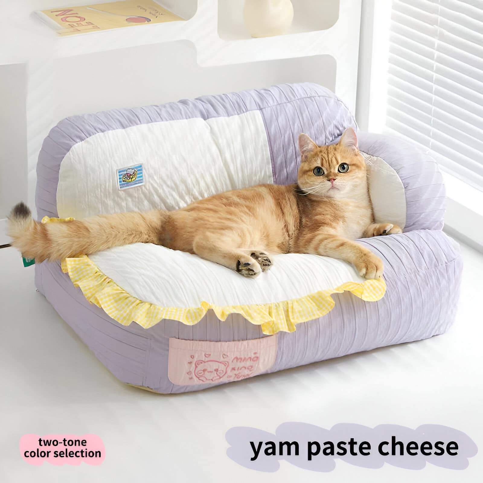 Comfortable pet bed with pastel purple and white fabric, ideal for cats; features a ruffled edge, soft cushioning, and a cozy design perfect for feline relaxation.