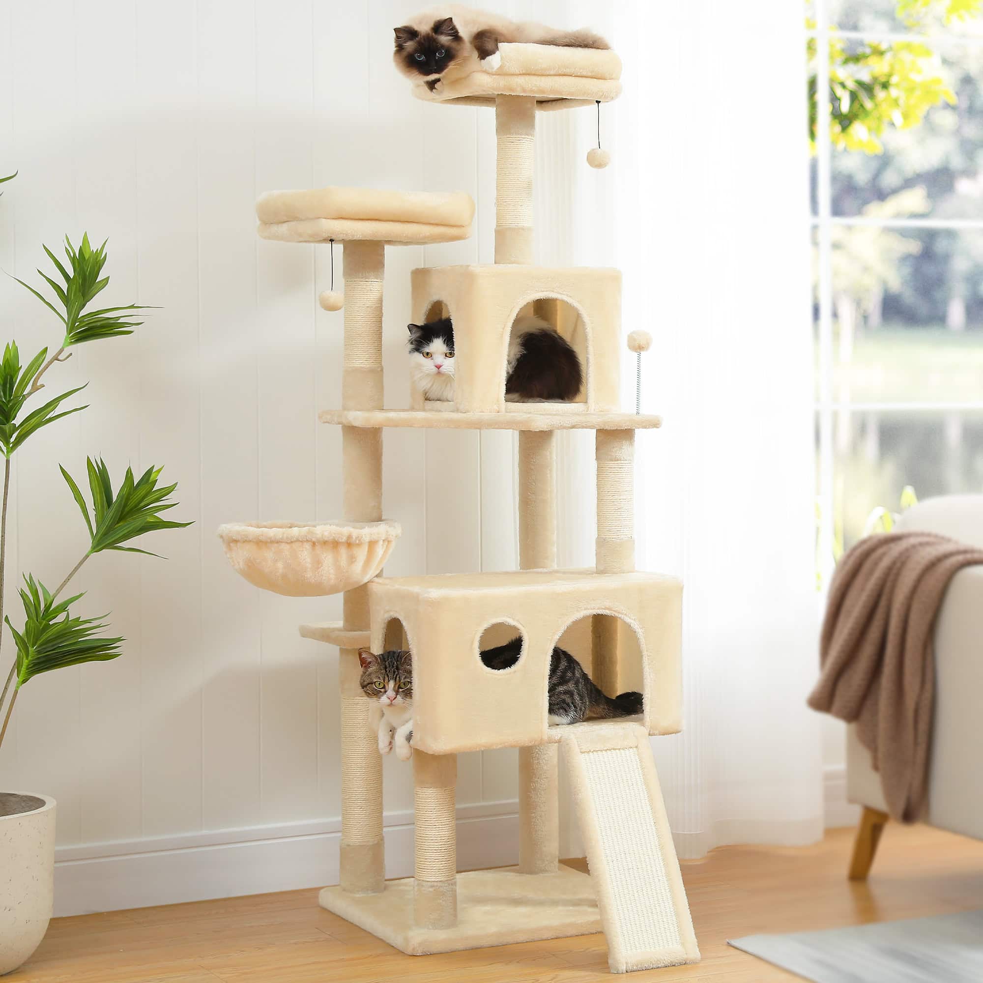 Luxurious beige cat tree with multiple platforms, hideouts, and a slide, perfect for indoor pets; includes cozy compartments and scratching posts for cats' entertainment and comfort.