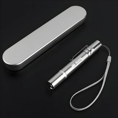 Stainless steel LED flashlight with sleek design, removable wrist strap, and durable carry case, ideal for medical, emergency, or everyday use.