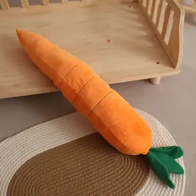 Soft plush carrot toy for children and babies, perfect for play and sensory learning, with a green leafy top, ideal for nursery decor or educational activities.