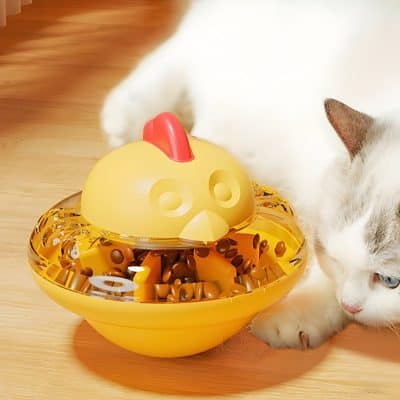 Colorful chicken-shaped pet food dispenser with cat eating nearby, ideal for pet feeding, affordable pet supplies, and innovative pet feeding solutions.